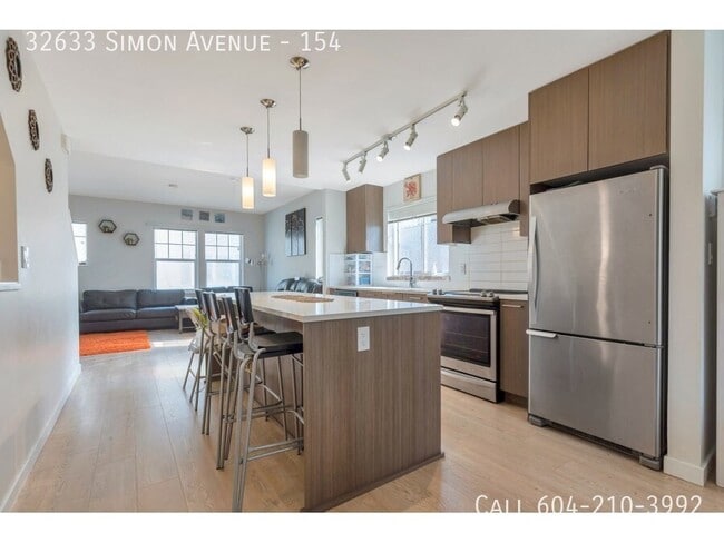 Building Photo - Corner Unit Townhouse In Abbotsford!