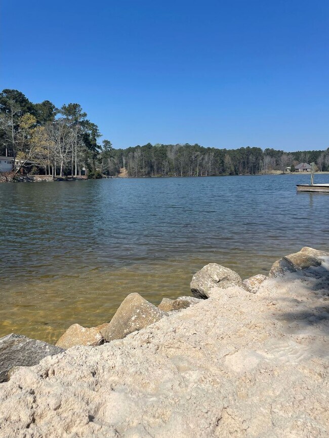 Building Photo - Partially Furnished Lakefront Retreat in Sunset Bay – Stunning Views & Resort-Style Amenities