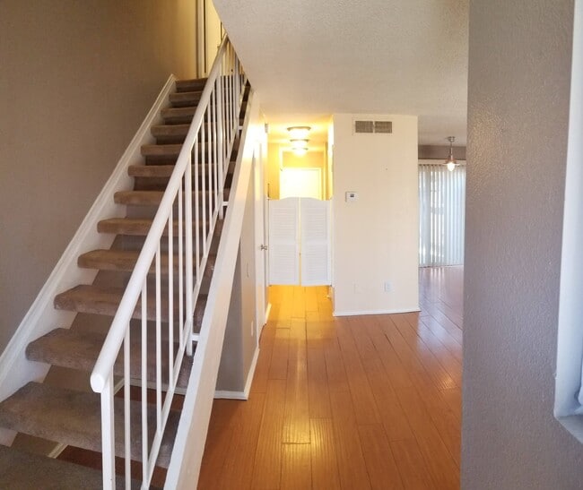 Entry, stairs, kitchen saloon doors - 1674 W Village Way
