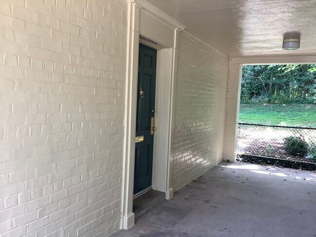 The sheltered entryway keeps the weather away as you arrive home. - 1128 Valley Dr