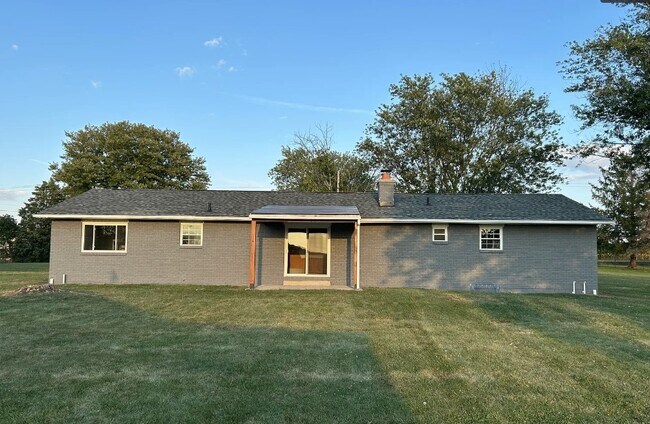 Back of house with newly built covered porch, new exterior paint and stain - 2751 Hart Rd