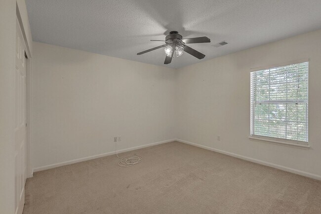 Building Photo - Spacious 4-Bedroom Home in The Bridges of ...