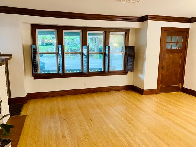 Large front windows with shutters - 2713 E Oklahoma Ave
