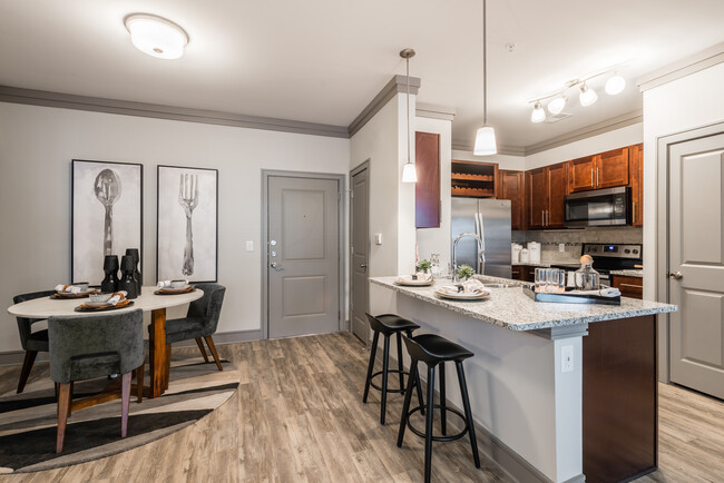 Kitchen and dining areas with hard-surface vinyl plank flooring - Avalon Perimeter Park