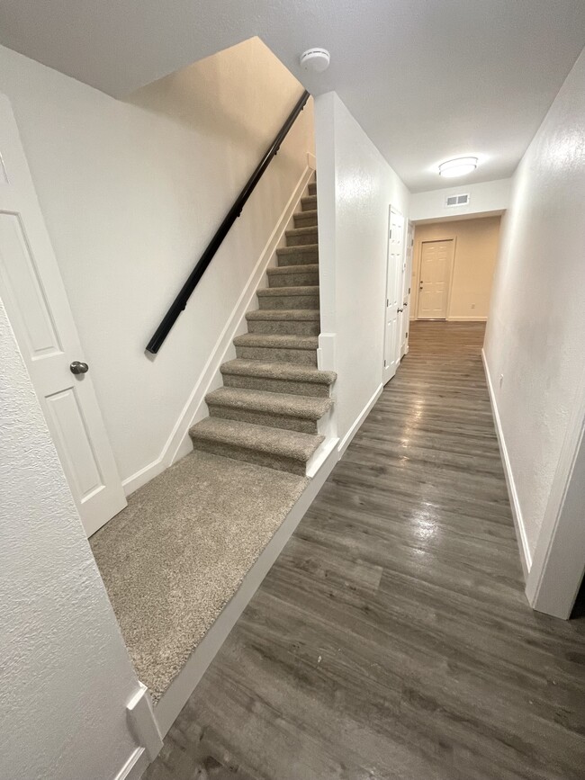 View from the front door. Hall leads to the living room; kitchen off to the right. - 14553 Old Courthouse Way