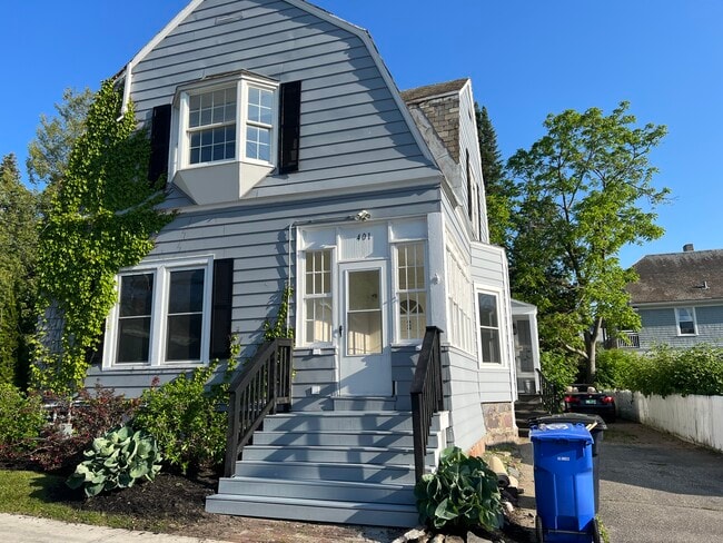 Front door to the downstairs apartment leads you to a beautiful porch before you enter the home. - 401 North St