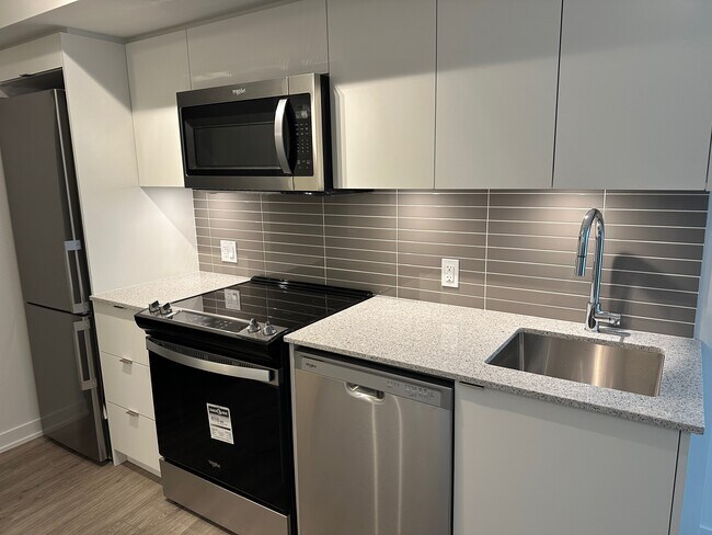 Photo du bâtiment - Contemporary 1-Bdrm + Den + 1 Parking Spot Condo for Rent in North York!