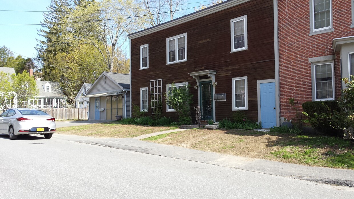 Exterior of Court Street entrance; subject apartment is situated above the blue door in the photo. - 75 Court St