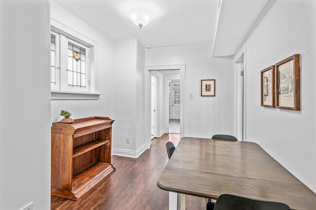 Dining room with stained glass windows. - 3441 Shenandoah Ave