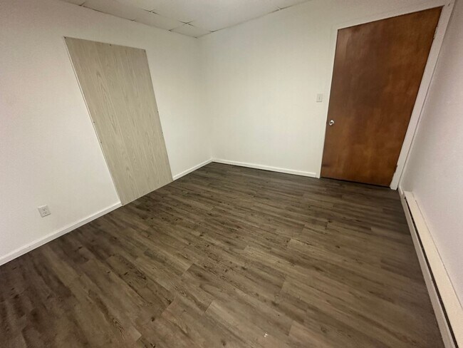 Building Photo - Modern & Efficient 2-Bedroom with Stylish Vinyl Plank Flooring