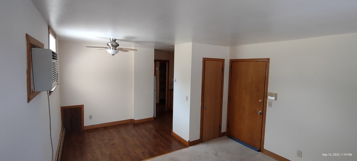 Living room looking at entry and closet - 3969 5th St NE