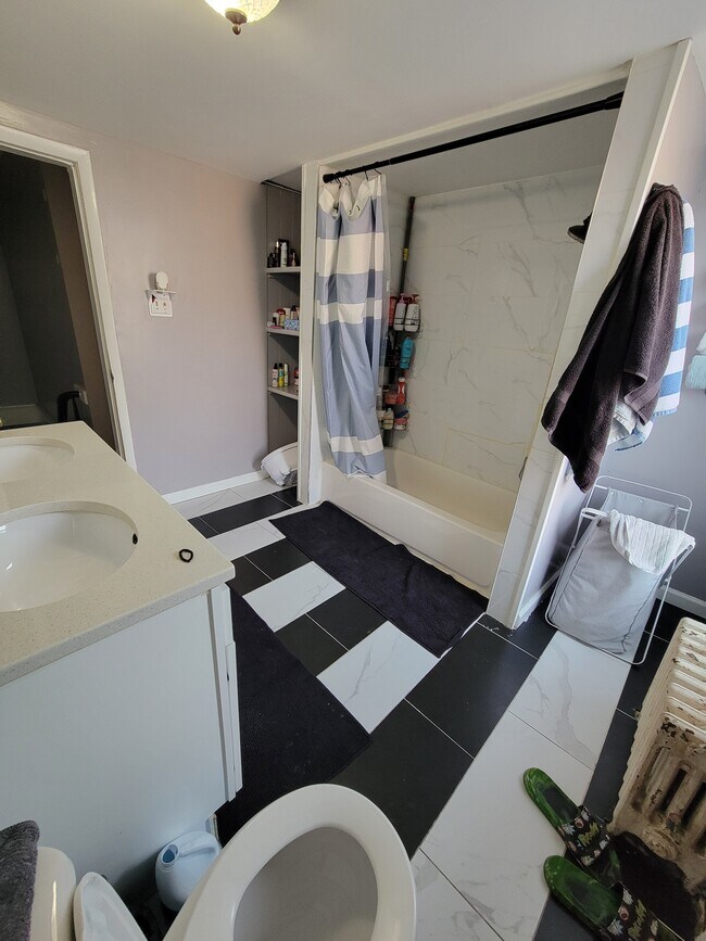 Full bathroom w/ double vanity and storage space - 91 Dow St