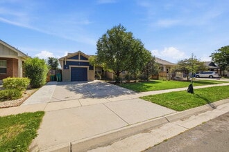 Building Photo - Spacious 5-Bed Retreat with Modern Updates in Aurora. Included - Greenhouse and Shed!