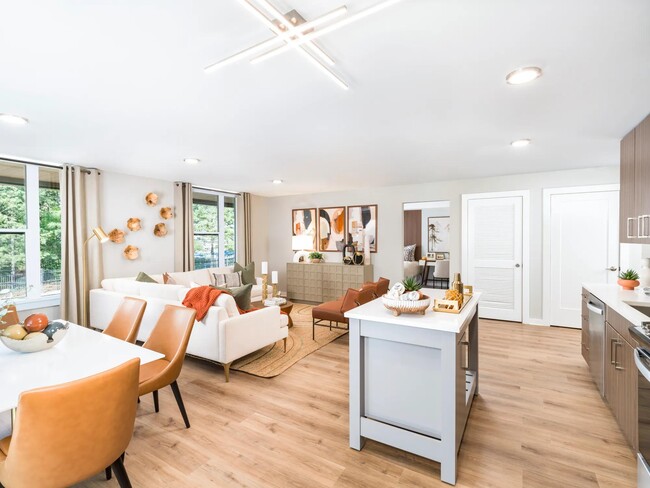 Airy interiors with open layouts and generous natural light. - Modera LoSo