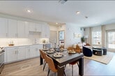 Located at 100 Eisenhower Parkway in Livingston, NJ, this thoughtfully designed 2-bedroom, 2-bathroom residence offers a seamless blend of modern style and everyday functionality. The open-concept living area serves as the heart of the home, where the kitchen, dining, and living spaces flow together effortlessly. The kitchen is outfitted with crisp white shaker cabinetry, a classic subway tile backsplash, stainless steel appliances including a French door refrigerator and dishwasher, and a undermount sink — all set against light hardwood-style flooring that extends throughout the unit. The living room enjoys generous natural light through large windows and features a neutral, textured accent wall that adds depth to the space. The primary bedroom is a well-proportioned retreat with its own walk-in closet featuring built-in shelving and dual hanging rods. The en-suite primary bathroom offers a long double-vanity with gray countertops, white cabinetry, marble-look tile flooring, and dark tile wall accents. The second bedroom is bright and comfortable, with a ceiling fan and an exterior-facing window. A second full bathroom mirrors the refined aesthetic with matching marble-look tile and a white vanity. A second walk-in closet with wire shelving provides additional storage. Recessed lighting throughout completes the polished, contemporary feel of this well-appointed residence.