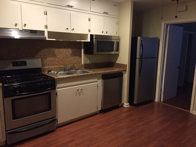 Updated kitchen, new stainless steel whirlpool appliances. - 1512 South Louisiana Street