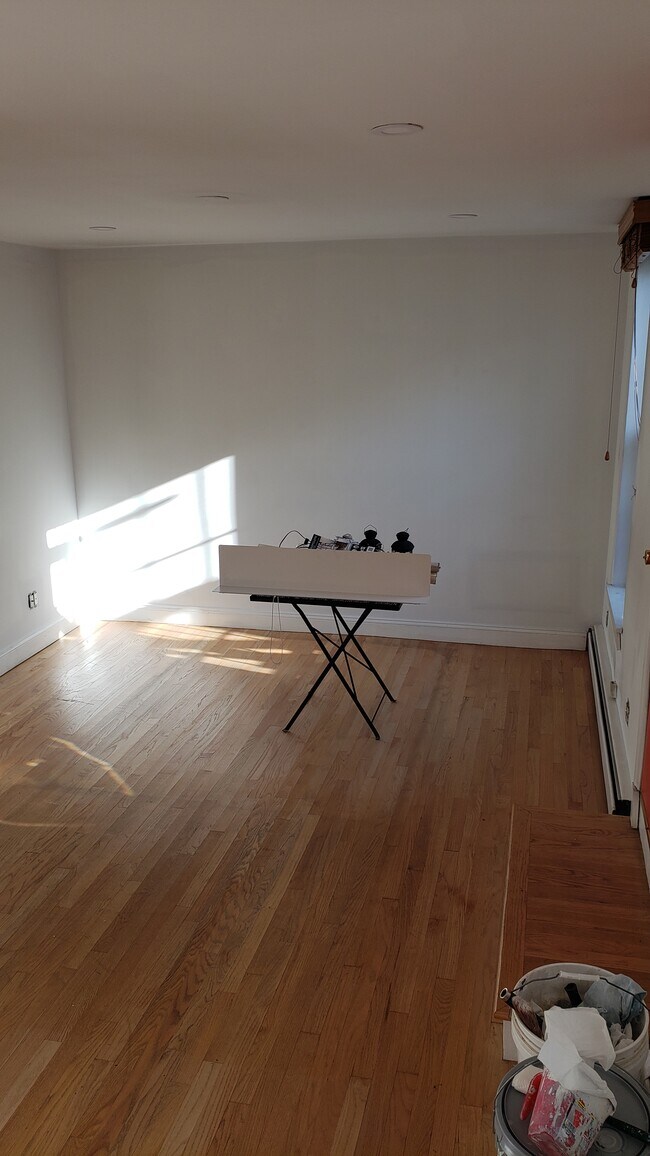 Large bedroom with red door to garden facing deck - 234 S 2nd St