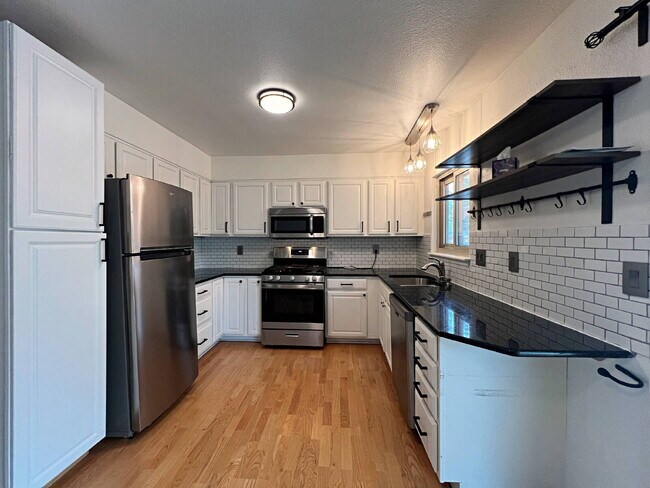 Foto del edificio - Charming Aurora Retreat with Gardener's Paradise Backyard - Pet Friendly