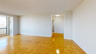 This 730 square foot apartment in Toronto offers a thoughtful blend of comfort and functionality. The single-floor layout encompasses a living room, bedroom, kitchen, bathroom, and hallway, making efficient use of the available space. The primary bedroom, measuring 180 square feet, provides ample room for rest and relaxation.

The apartment's standout feature is its large windows, which flood the living areas with natural light and offer breathtaking views of the Toronto cityscape. The gleaming parquet flooring throughout adds warmth and character to the space, while also enhancing the overall brightness.

The kitchen is equipped with modern white cabinetry, providing ample storage, and features a full-sized electric range. The bathroom, though compact, is well-appointed with a full-sized bathtub and clean, neutral tiling.

The living room is spacious and versatile, perfect for entertaining or relaxing. The bedroom features a large closet with sliding doors, maximizing storage in the compact space. 

Located at 2085-2101 Islington Ave, this apartment offers urban living with a touch of sophistication. The neutral color palette and clean lines create a canvas for personal style, while the panoramic views serve as a constant reminder of the vibrant city beyond.