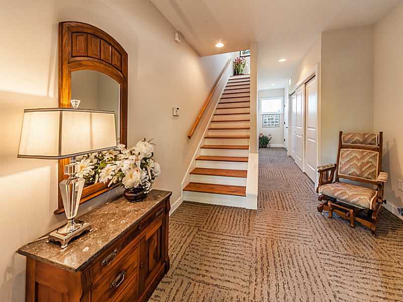 Welcoming entryway with large closets and elevator, to attached garage - 876 Woodruff Place West Drive