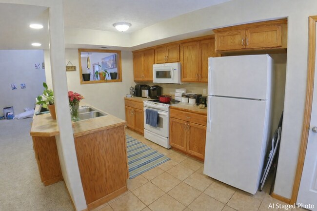Building Photo - Beautiful Town Home with Lake View! 2-Car Garage + Fenced-in Yard + Washer & Dryer Included + Pet...