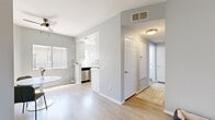 Located at 11005 Morrison Street in North Hollywood, this 2-bedroom, 1-bathroom unit offers a thoughtfully designed layout with a clean, modern aesthetic throughout. Light wood-toned flooring runs continuously across all rooms, complementing the soft gray walls and white trim that create a calm, cohesive atmosphere.

The living room serves as the heart of the unit, featuring a white tile-surround fireplace, natural light from a large window, and generous wall space. It flows seamlessly into the dedicated dining area, which is brightened by its own window and ceiling fan. The kitchen is efficiently laid out in a galley style, appointed with white cabinetry, quartz countertops, a tiled backsplash, and stainless steel appliances including a gas range and full-size refrigerator.

The primary bedroom is a spacious retreat with a mirrored sliding closet and ample natural light. The second bedroom is equally well-proportioned, offering a bright window and comfortable dimensions. The shared bathroom features a long white vanity with generous counter space, a tub-shower combination, and windows that allow in natural light.

A hallway connects the private areas of the unit, maintaining a clean flow throughout. The overall design is minimal and move-in ready, making this a well-appointed residence in the heart of Los Angeles.