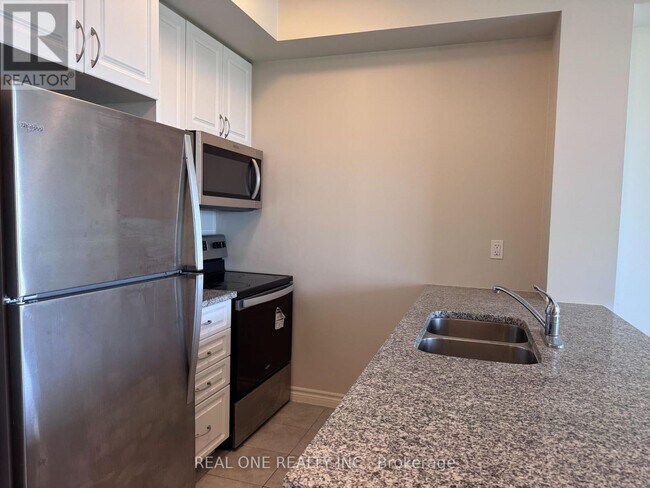 Photo du bâtiment - 349-1349 Rathburn Rd W