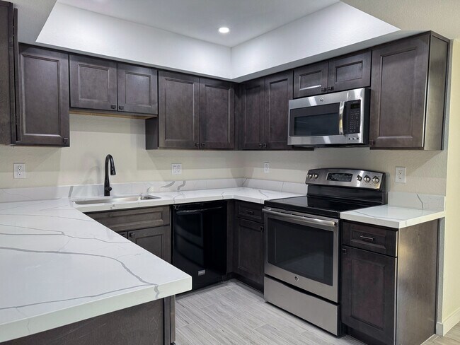 Kitchen - 9445 N 94th Plz Apartment