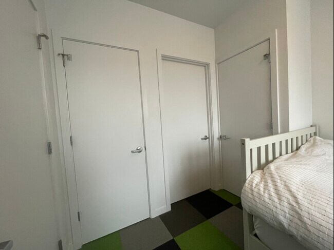 Middle door leads to private bathroom, other two are 7sqft closets - 1837 Patterson St