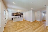 Located at 4097 General Pkwy in College Station, TX, this well-appointed two-story home offers a thoughtfully designed layout across two floors. The main level welcomes you through an entrance that opens into a bright living room featuring light hardwood flooring, recessed lighting, and a distinctive board-and-batten accent wall. The open-concept layout flows seamlessly into the dining area and kitchen, where rich dark cabinetry, crisp white quartz countertops, stainless steel appliances, a central island with pendant lighting, and a convenient adjacent pantry come together to create a functional and stylish culinary space. A garage with an automatic opener and a dedicated hallway round out the ground floor.

Upstairs, the carpeted staircase with a warm wood handrail leads to the upper level, which houses all four bedrooms, each with its own closet. The primary bedroom features plush carpet, a ceiling fan, and direct access to a private ensuite bathroom with dark vanity cabinetry and modern fixtures. The home's seven bathrooms are consistently finished with clean tile surrounds, matte black hardware, and dark wood cabinetry. Throughout, the home maintains a cohesive modern aesthetic with neutral tones and quality finishes.