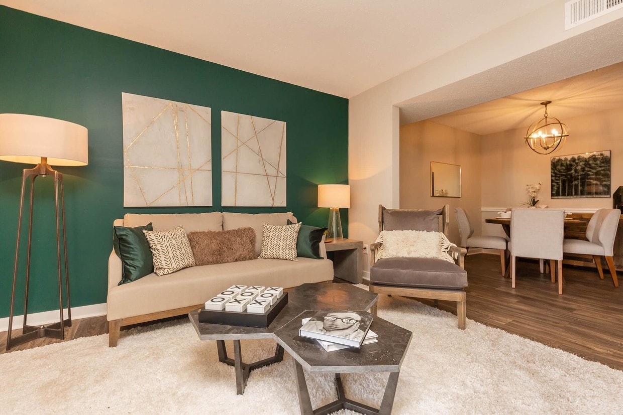 SPACIOUS LIVING ROOM AT MADISON LANDING AT RESEARCH PARK AND THE COTTAGES APARTMENTS - Madison Landing at Research Park and the Cottages