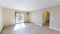 Located at 6712 Harrison Ave in Cincinnati, Ohio, this 2-bedroom, 1-bathroom unit offers a practical and comfortable single-floor layout. The bright living room features light-toned hardwood-style flooring, a ceiling fan, and baseboard heating, with a sliding glass door that opens to a private balcony overlooking a tree-lined outdoor area. Natural light fills the space throughout the day, creating a welcoming ambiance. The dining area flows naturally from the living room, complementing the open feel of the common areas. The kitchen is equipped with warm wood cabinetry, granite-style countertops, and a full-size refrigerator, with an adjacent pantry providing additional storage. Both bedrooms are carpeted and well-sized, with the primary bedroom offering generous closet space including a full walk-in style closet. Each bedroom includes a wall air conditioning unit and baseboard heating for year-round comfort, as well as windows that invite natural light and outdoor views. The full bathroom features tile flooring, a tub-shower combination, a white vanity with storage, and clean, bright finishes. Four closets throughout the unit ensure ample storage. The space is efficiently designed to maximize functionality across every room.