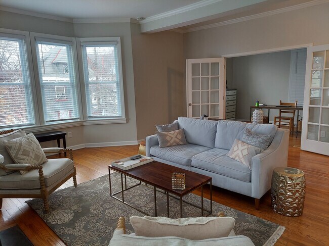 Living Room w/ French doors to spare bedroom - 5800 Walnut St