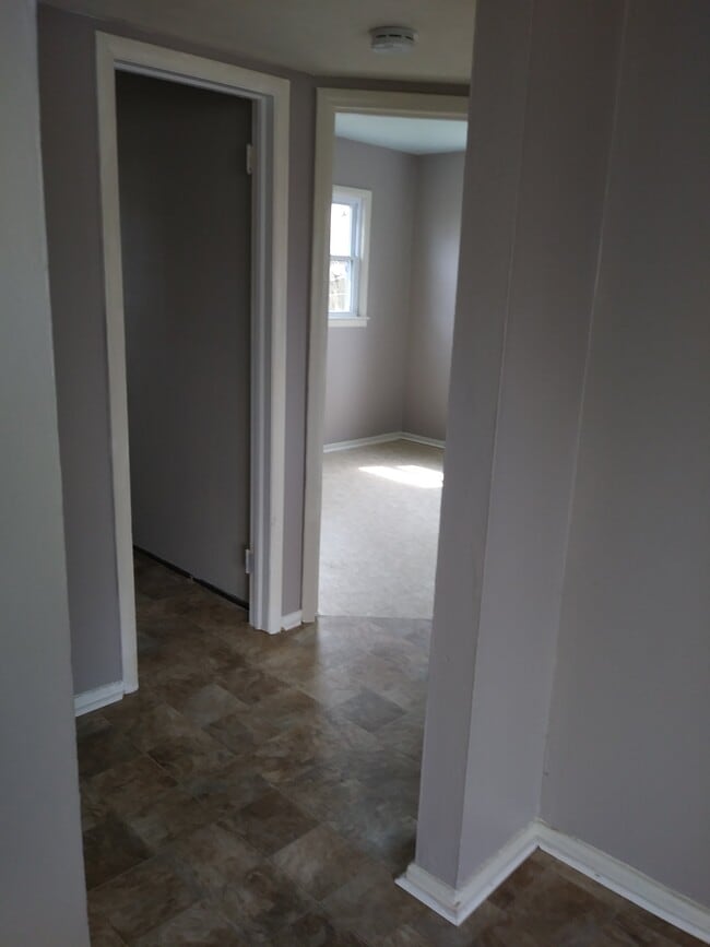 Hall to bedrooms and full bath - 7005 John Adams Way