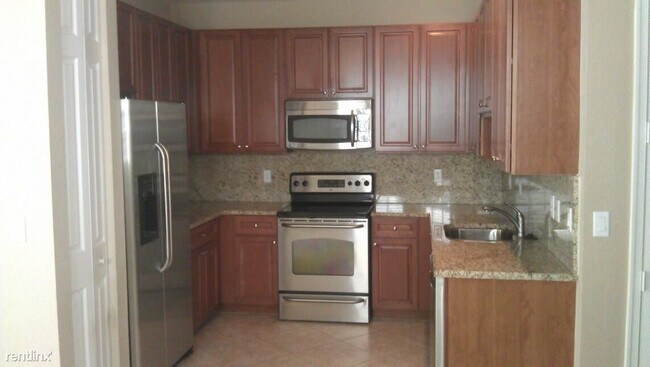 Foto del edificio - 4 br, 2.5 bath Condo - 16122 Poppyseed Cir...