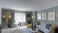 This single-floor space showcases a thoughtfully designed open-concept living and dining area bathed in natural light. The living room features soft grey-blue walls complemented by crisp white crown molding and a textured ceiling, creating a refined yet comfortable atmosphere. A large window fitted with vertical blinds and layered curtains allows generous daylight to flow into the space while offering views of the surrounding urban landscape.

The living area is anchored by a neutral-toned sofa accented with decorative pillows, paired with a round white coffee table displaying carefully selected decorative accessories. A pair of framed art pieces adorns the walls, adding visual interest alongside a contemporary arc floor lamp. A vibrant yellow accent chair introduces a pop of color and personality to the space.

Adjacent to the living area, a compact dining nook features a round glass-top table surrounded by modern chairs, ideal for casual meals. Plush carpeting runs throughout, enhancing the warmth of the space. A potted indoor plant adds a touch of greenery, contributing to the overall fresh and welcoming ambiance of this well-appointed home.