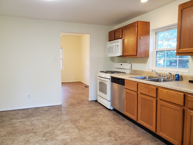 Kitchen looking into Living Room - 25 Maple St