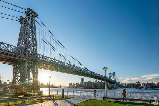 Domino Park spans a quarter-mile along the East River near the Williamsburg Bridge.