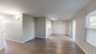 Located at 2709 Sequoia Dr in Saint Peters, MO, this well-appointed 2-bedroom, 2-bathroom single-floor home offers a thoughtfully designed layout with a clean, neutral aesthetic throughout. The open living area is anchored by a tiled fireplace flanked by two windows that bring in natural light, and features durable hardwood-style flooring that extends through the main living spaces. A ceiling fan adds both function and style to the room, while sliding glass doors lead to an outdoor patio, creating a seamless indoor-outdoor connection. The kitchen is efficiently laid out with white cabinetry, granite-look countertops, and black appliances including a range, microwave, and dishwasher. Both bedrooms are carpeted for comfort and include closets with built-in rods for organized storage. The spacious primary bedroom connects directly to its own bathroom, which features white cabinetry with granite-look counters and a vanity with ample lighting. The second bathroom offers a tub-shower combination with wood-style flooring and matching finishes. A hallway and dedicated closet provide additional storage and connectivity throughout the home. The consistent use of neutral tones and updated finishes gives the entire space a fresh, move-in-ready feel.