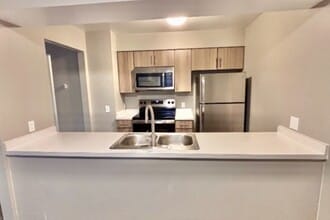 2-bed Renovated Kitchen - The Neighborhood at Englewood