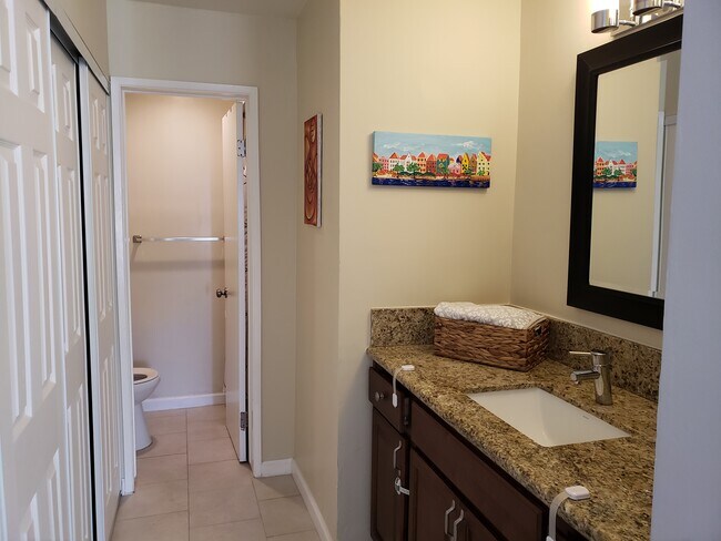 Attached bathroom with incredibly large closet opposite the sink - 1775 Diamond St