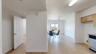 Located at 5255 NW 29th Ave in Miami, FL, this one-bedroom, one-bathroom unit offers a functional and efficiently designed single-floor layout. Light-toned ceramic tile flooring runs throughout the entire space, creating a clean, cohesive look that is well-suited to Miami's warm climate.

The combined living and dining area forms the heart of the unit, bathed in natural light from a sliding glass door that opens onto a private balcony with outdoor views. A ceiling fan overhead enhances airflow and comfort. The open layout allows for flexible furniture arrangements and provides a welcoming sense of space.

The kitchen is positioned adjacent to the living area and features light wood cabinetry, dark granite-style countertops, stainless steel appliances including a dishwasher and electric range, and a double sink — offering both style and practicality for everyday cooking.

The bedroom is a well-proportioned retreat with its own ceiling fan, a large window providing natural light and outdoor views, and a built-in closet with sliding panel doors. Additional closets are found throughout the unit, offering generous storage options.

The bathroom includes a full soaking tub with tiled surround, a toilet, and a vanity with dark countertop and wood cabinetry. A dedicated laundry area completes the unit's practical amenities, rounding out this well-appointed Miami residence.