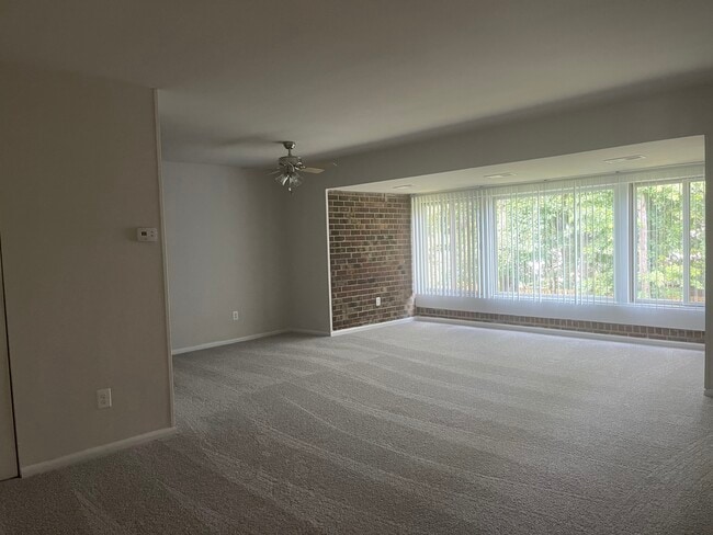 Living room, dining room, and sunroom - Skyview Apartments