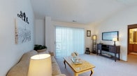 Located at 4333 Parkway Village Dr in Grove City, Ohio, this single-floor residence offers a comfortable and well-appointed living environment. The living room serves as the centerpiece of the home, showcasing plush wall-to-wall carpeting that adds warmth underfoot. A large sliding glass door dressed with vertical blinds floods the space with abundant natural light, creating an airy and open atmosphere while providing direct access to the outdoors. The neutral white walls and ceiling contribute to a clean, bright aesthetic that complements a variety of interior styles. There is ample room for seating and entertainment furniture, making the living area both functional and inviting. The layout flows naturally, offering a sense of ease and accessibility throughout the single-level floor plan. The overall ambiance of the space is calm and welcoming, ideal for everyday living. Situated in Grove City, OH, the property benefits from a well-established residential community setting, combining practical design with a comfortable, livable feel.
