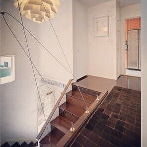 staircase landing toward kitchen - 5587 Village Grn