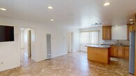 Located at 760 Embarcadero del Norte in Goleta, CA, this single-story, 3-bedroom, 2-bathroom home offers a practical and comfortable layout with consistent tile flooring throughout. The kitchen serves as a functional centerpiece, featuring warm honey-toned cabinetry, granite countertops, a tile backsplash, a central island with additional counter space, and a full suite of stainless steel appliances including a gas range, microwave, dishwasher, and refrigerator. Recessed lighting and a track light fixture illuminate the space, while vertical blinds on a large window allow for adjustable natural light.

A hallway connects the kitchen to the three bedrooms, each finished with the same durable tile flooring and crisp white walls. Several bedrooms benefit from windows with outdoor views, and the primary bedroom includes a ceiling fan with recessed lighting. Two closets provide dedicated storage throughout the home.

The two bathrooms are finished with coordinating tile. One features a glass-enclosed standing shower with a rich wood-toned vanity and granite countertop, while the second offers a pedestal sink, toilet, and wall-mounted storage cabinet. Natural light filters into both bathrooms via transom-style windows, keeping the spaces bright and functional.