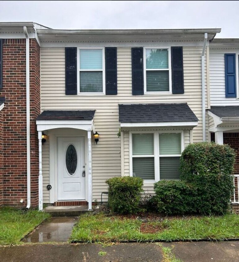 Primary Photo - Introducing a charming townhome in the hea...
