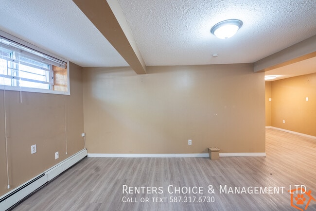 Building Photo - Basement Unit With Onsite Laundry, Close t...