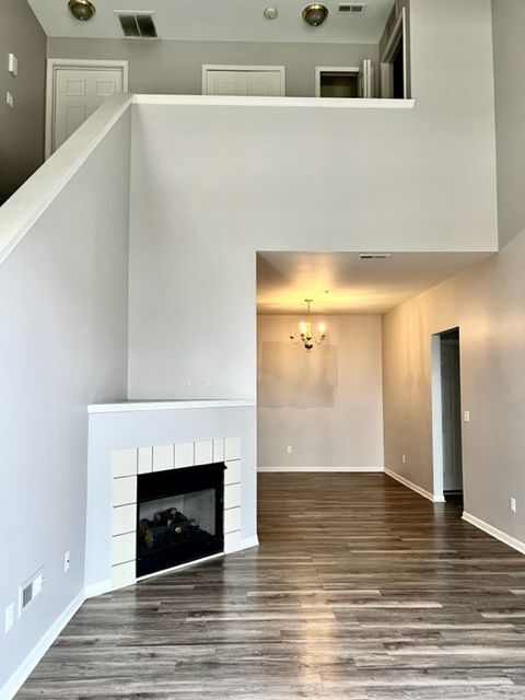 Fireplace in living area w/attached dining area - 6106 Addington Dr
