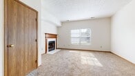 This two-story property at 4551 Durrow Dr, Columbus OH 43228 offers a blend of comfort and practicality. The living area is anchored by a traditional fireplace with a wooden mantel, creating a cozy focal point. Large windows allow natural light to flood the rooms, enhancing the sense of space. Neutral-toned carpeting extends throughout most living areas, providing warmth underfoot.

The kitchen features wooden cabinetry and is open to the living space, promoting a fluid layout ideal for entertaining. Bathrooms are equipped with standard fixtures, including a bathtub-shower combination in at least one, and a vanity with ample storage space.

Bedrooms are generously sized with large windows, offering plenty of natural light and potential for various furniture arrangements. The property includes functional spaces such as a laundry area with hookups for a washer and dryer.

The house layout, as seen in the 3D model, shows a well-organized floor plan with clearly defined living, sleeping, and utility areas. Textured ceilings and baseboard trim throughout add character to the interior. The overall design emphasizes functionality and comfort, making it suitable for a variety of lifestyle needs.